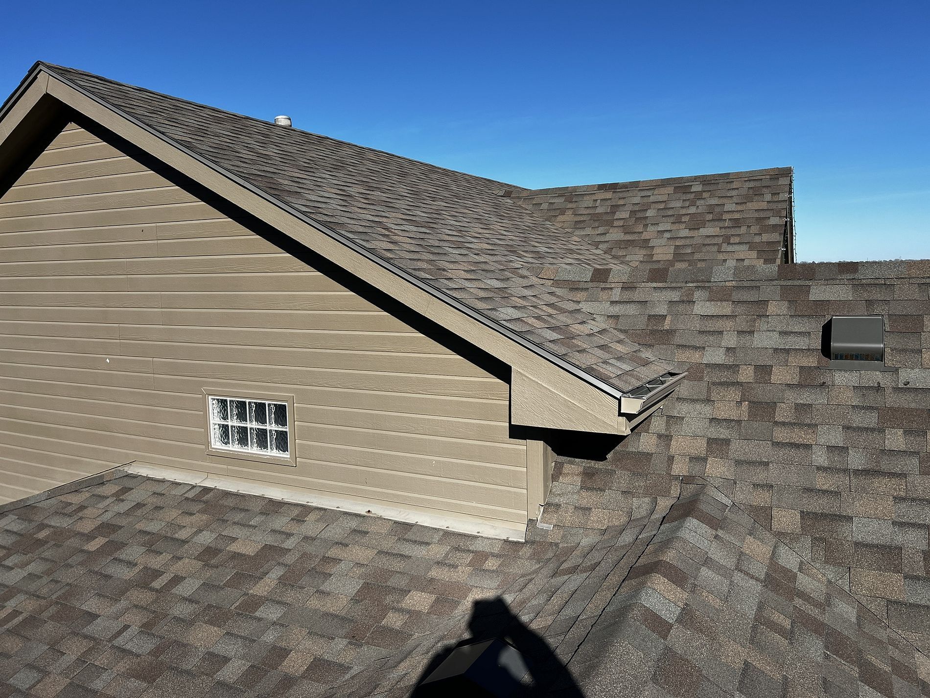 A house with a roof that has shingles on it