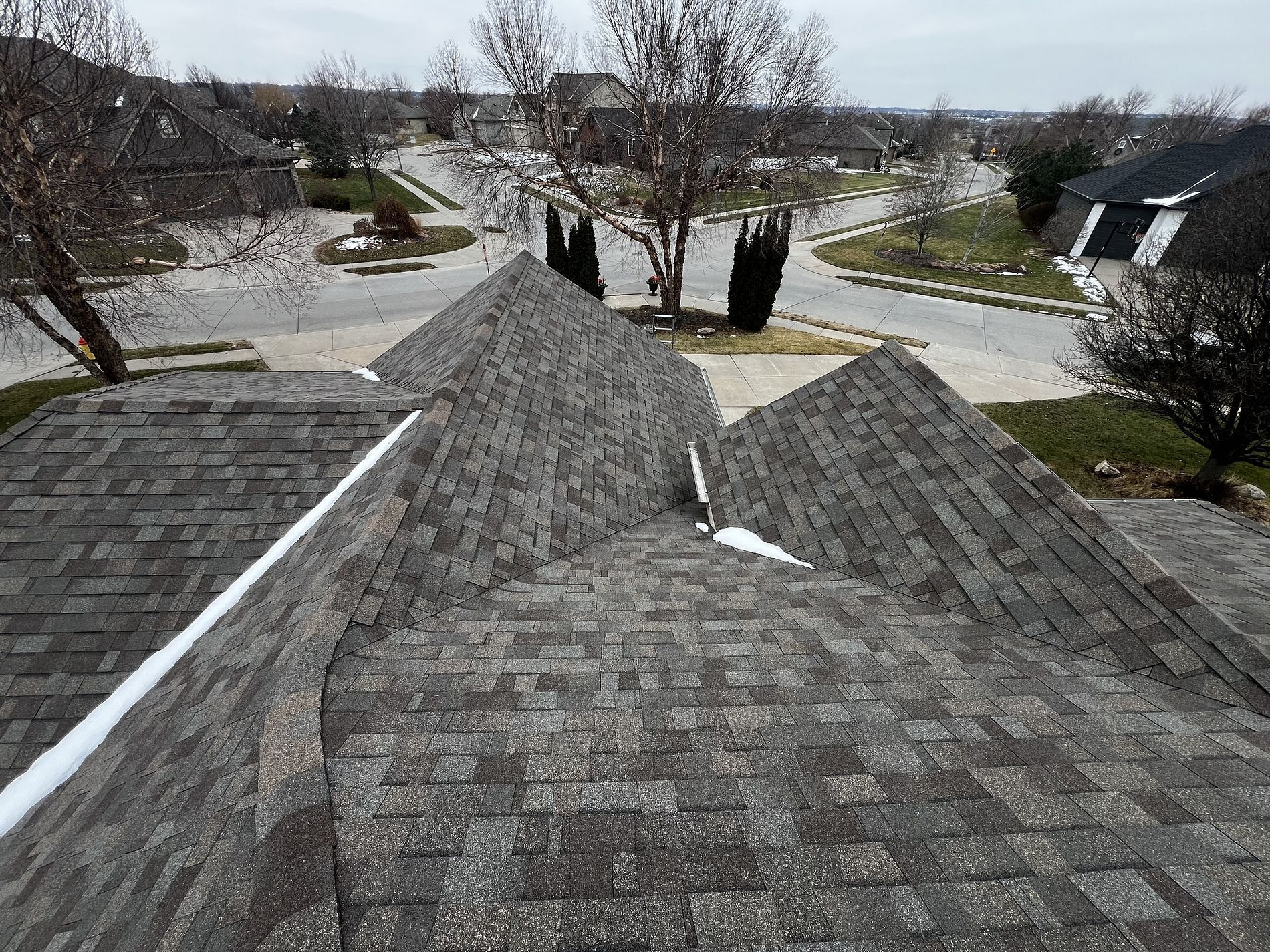 The roof of a house with a lot of shingles on it.