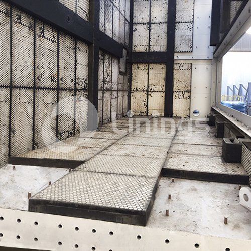 A building with a metal walkway going through it