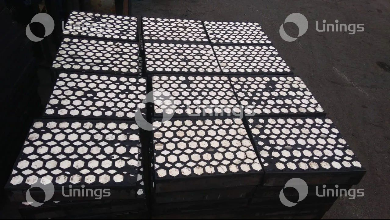 A bunch of boxes with holes in them are stacked on top of each other.