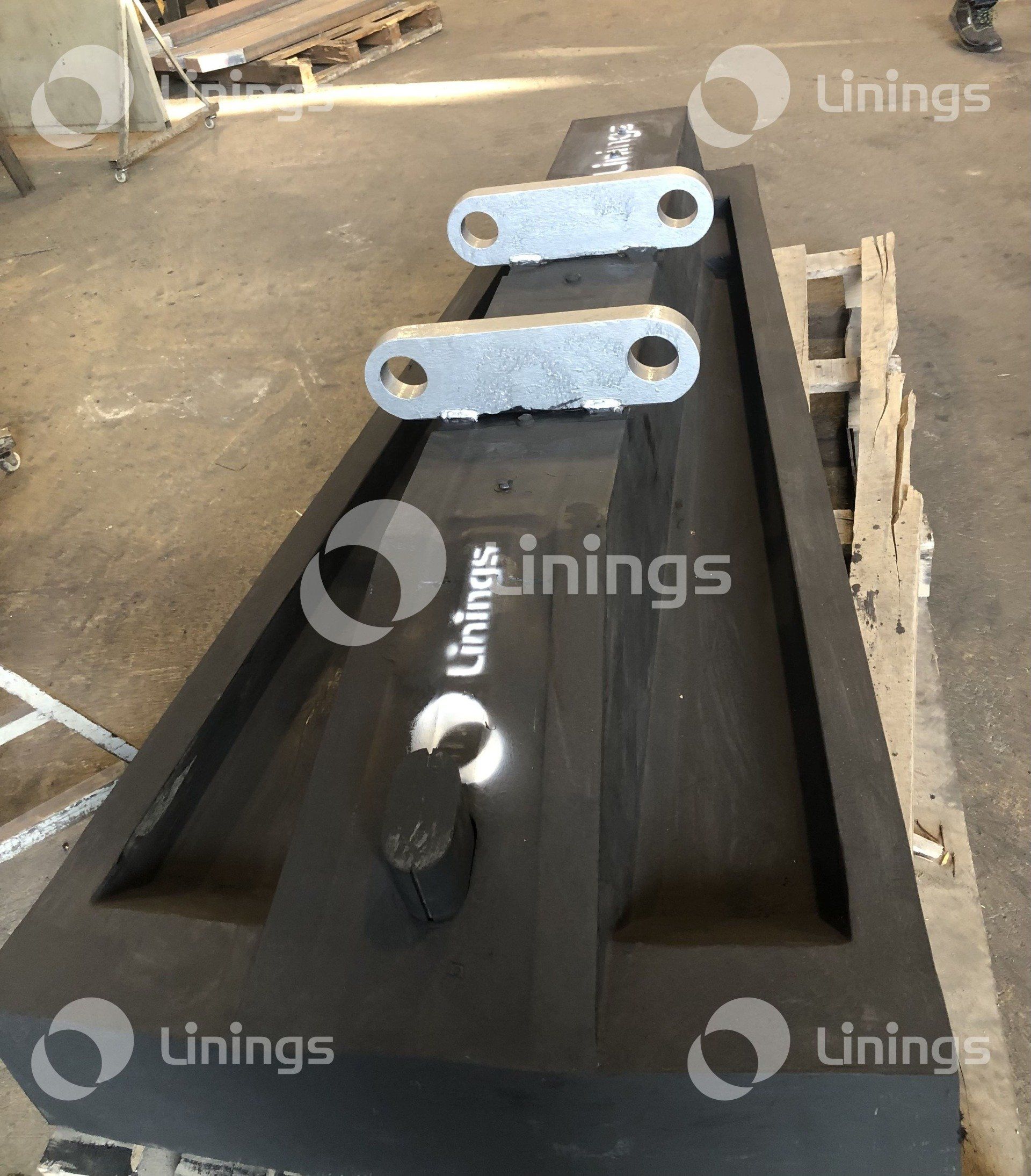 Um pedaço de metal com a palavra unings nele