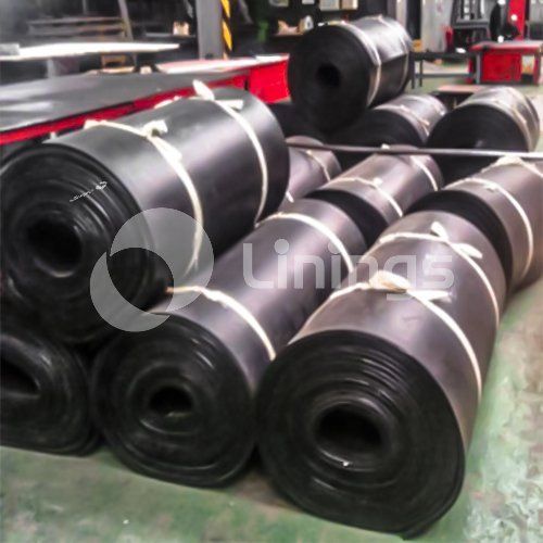 A bunch of rolls of rubber are stacked on top of each other