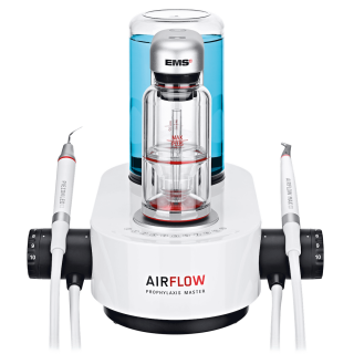 A dental machine called airflow is sitting on a white surface.