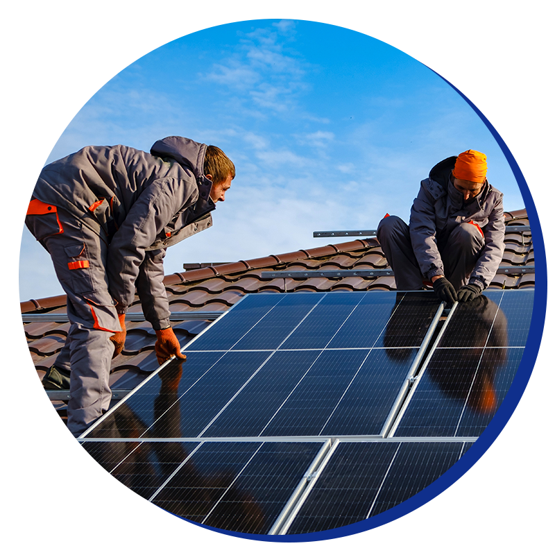 Two men are installing solar panels on a roof