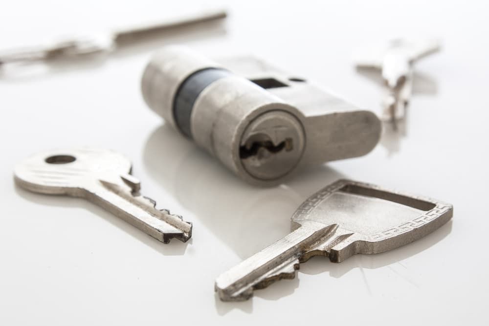 A Bunch of Keys and a Lock on a White Surface - Locksmith Services in Orange, NSM