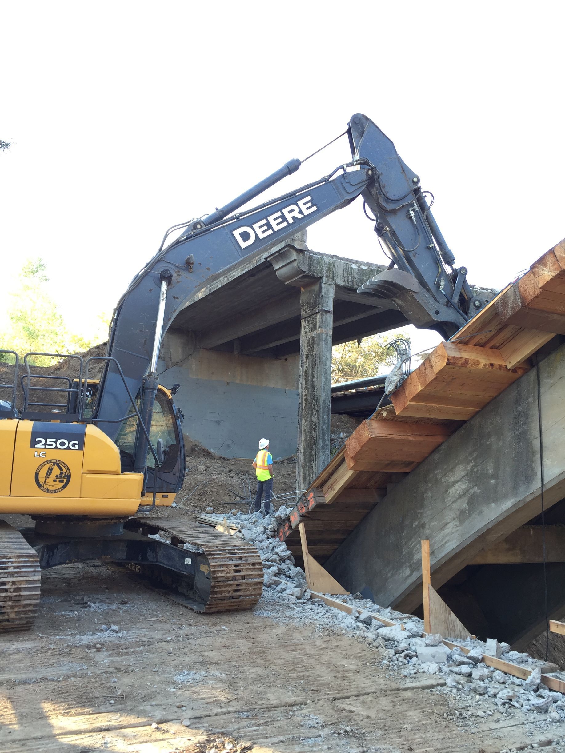 A Deere Excavator Is Demolishing a Bridge — Chicago, IL — Sterling Holloway Demolition