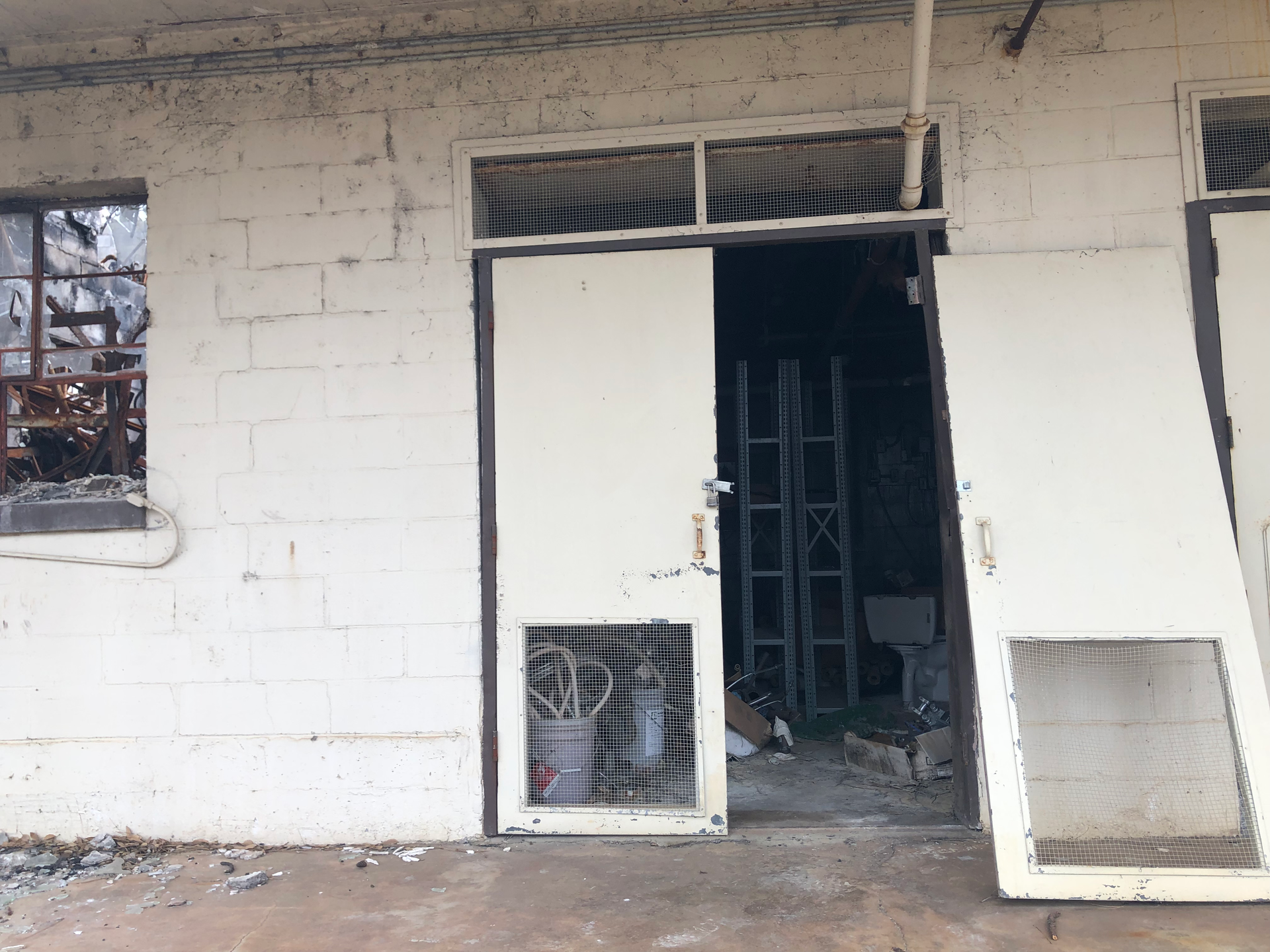 A White Brick Building With a Door That Is Open — Chicago, IL — Sterling Holloway Demolition