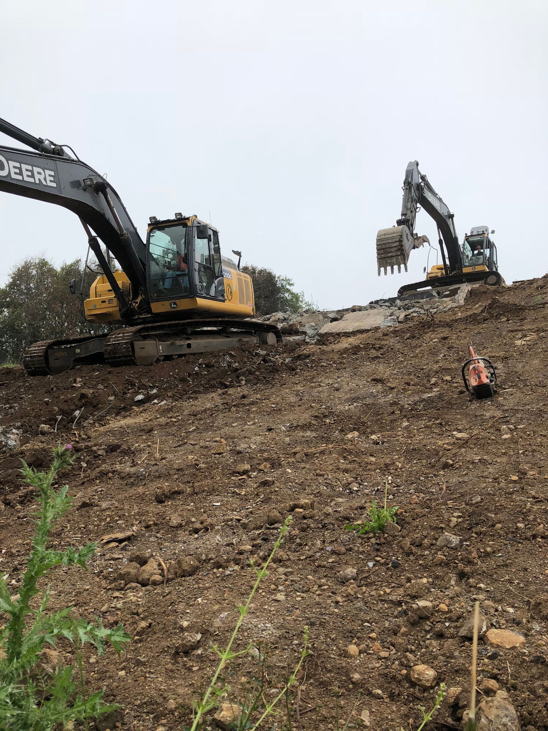 Two Excavators Are Working on a Dirt Hill — Chicago, IL — Sterling Holloway Demolition