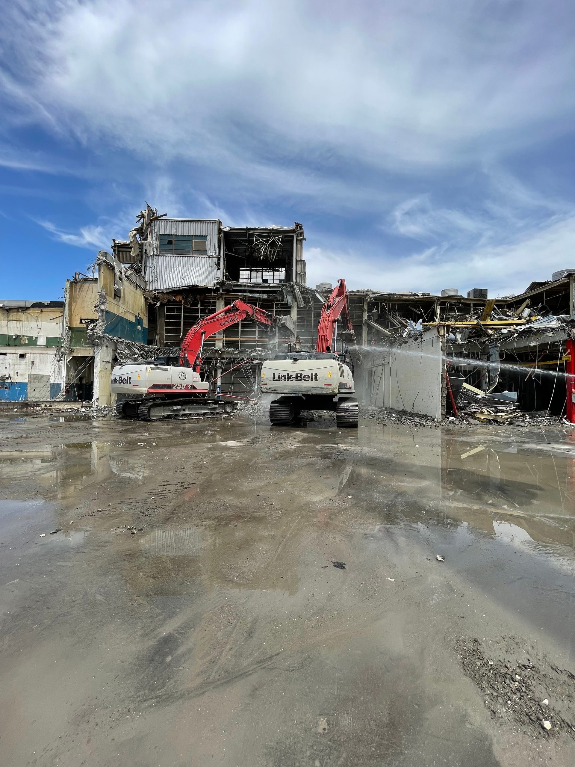 A Large Building Is Being Demolished by a Large Excavator — Chicago, IL — Sterling Holloway Demolition