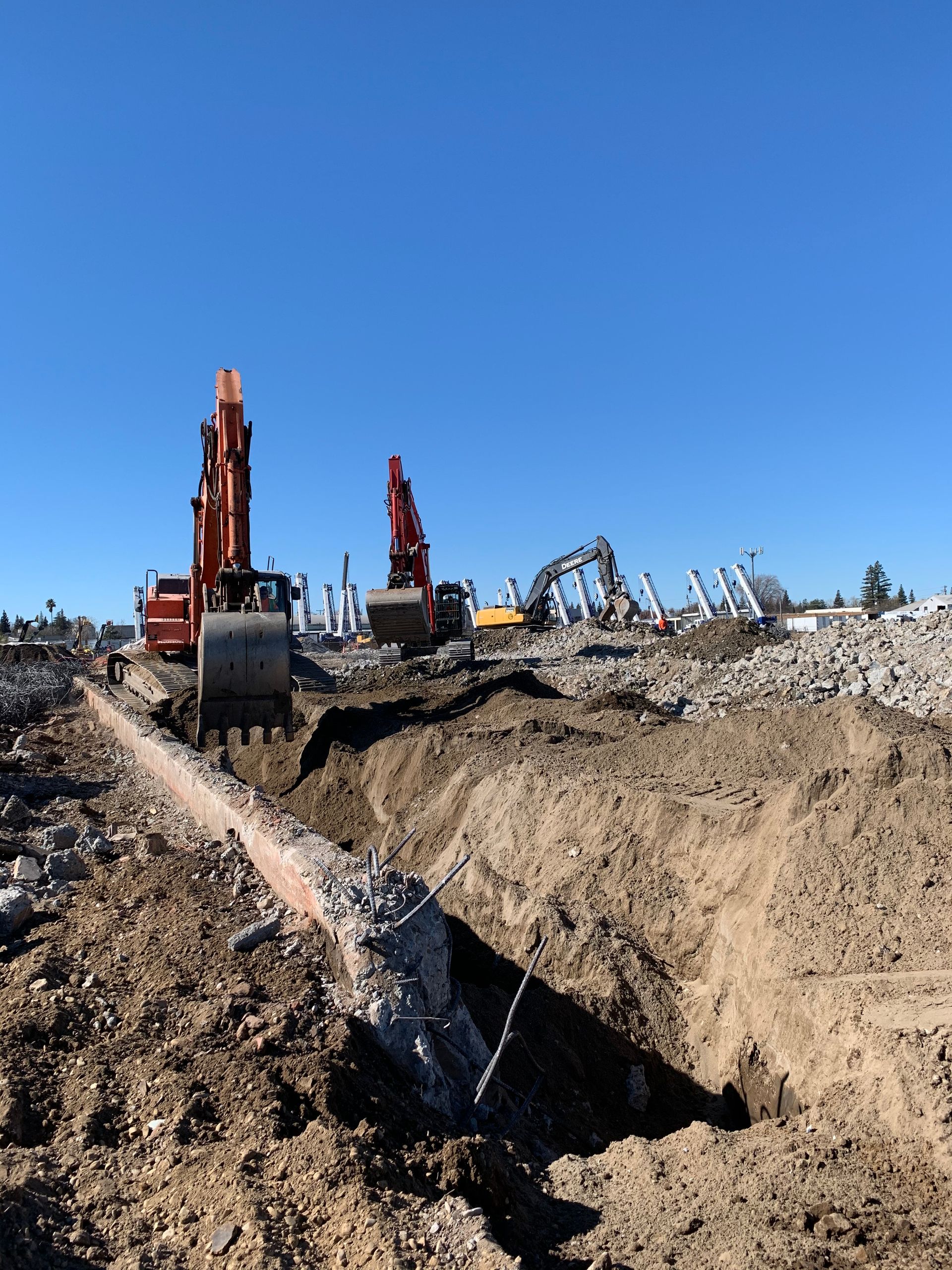A Construction Site With a Lot of Machinery in the Dirt — Chicago, IL — Sterling Holloway Demolition