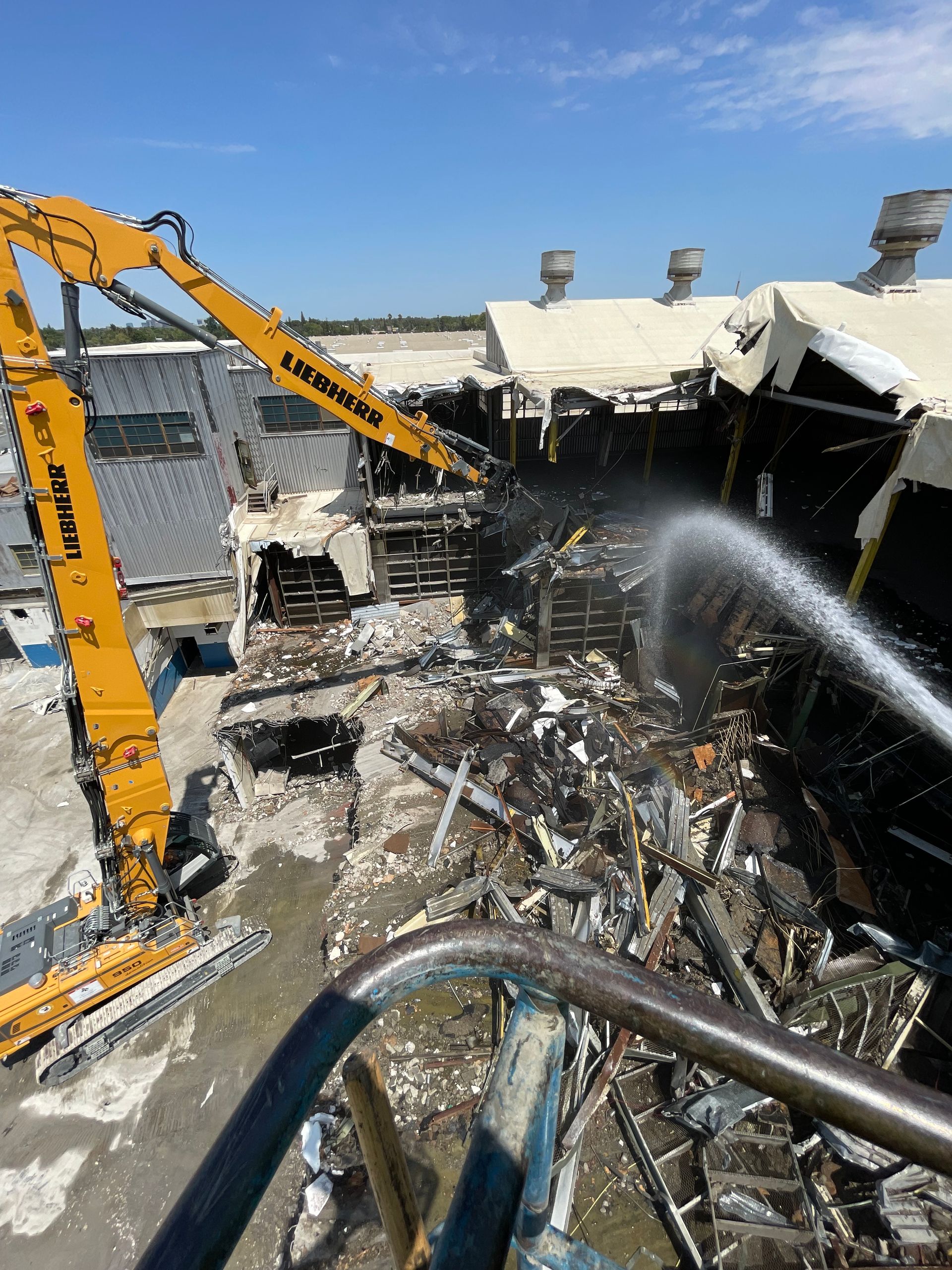 A Large Yellow Crane Is Being Used to Demolish a Building — Chicago, IL — Sterling Holloway Demolition