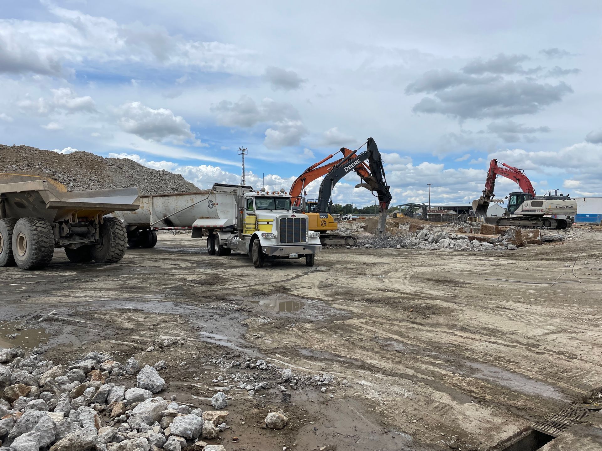 A Dump Truck Is Parked in the Middle of a Construction Site — Chicago, IL — Sterling Holloway Demolition