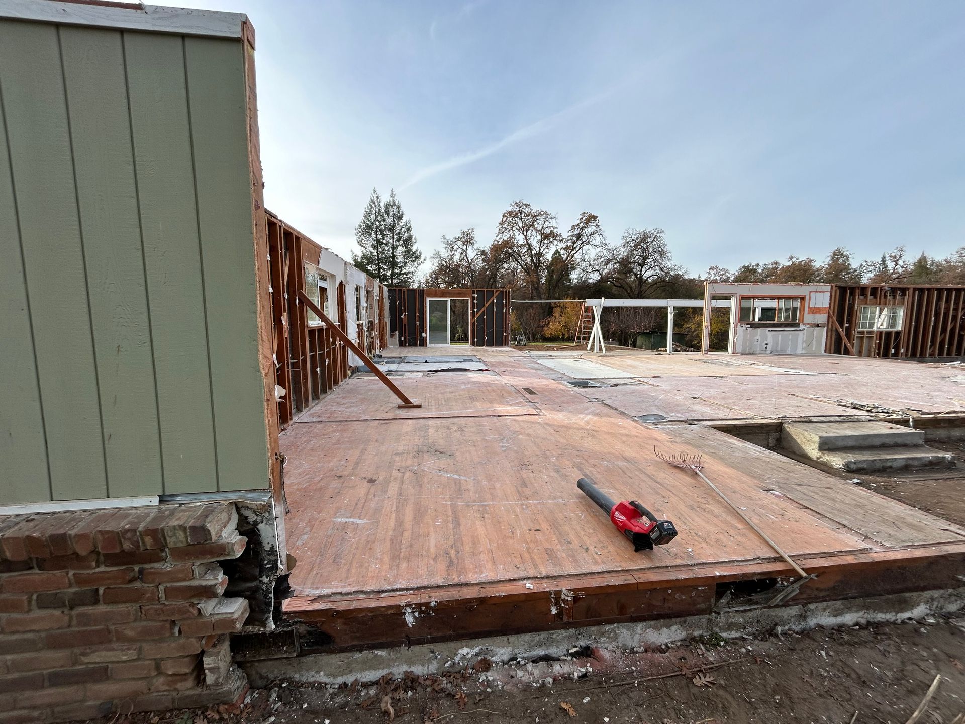 A House Is Being Built With a Lot of Plywood on the Ground — Chicago, IL — Sterling Holloway Demolition