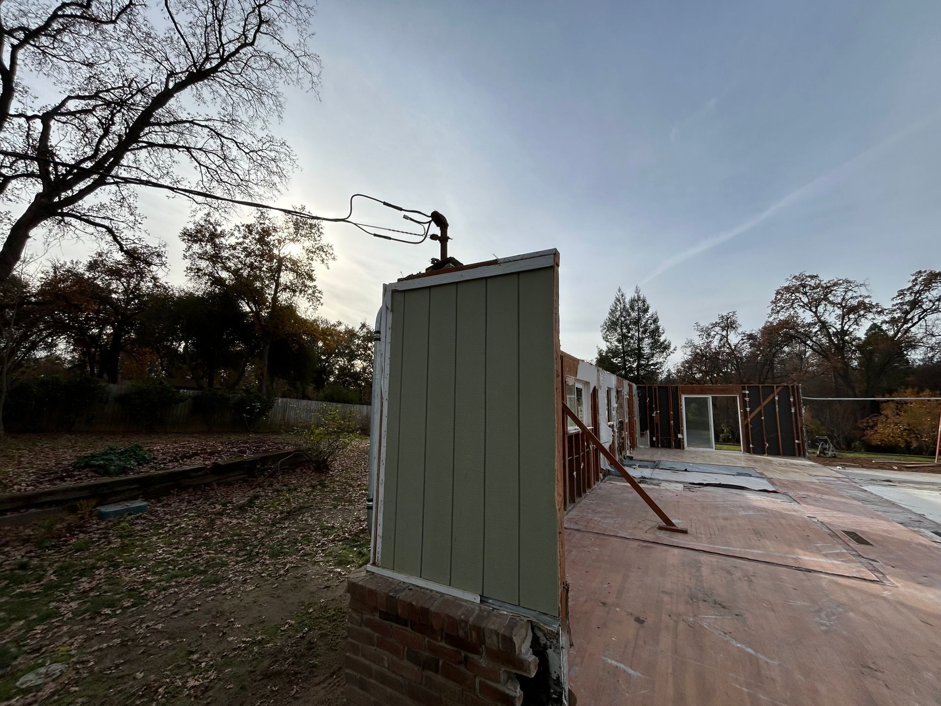 A Fence Is Being Built in the Backyard of a House — Chicago, IL — Sterling Holloway Demolition
