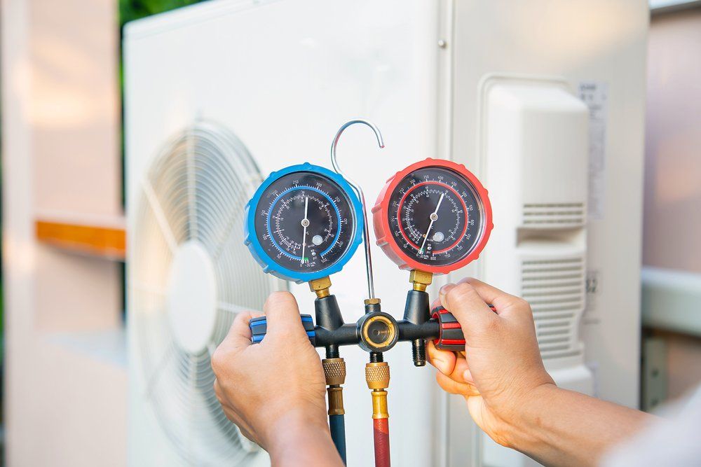 Using Measuring Tool To Check Air Conditioner — Johnson City, TN — Advanced Heat Pump Systems