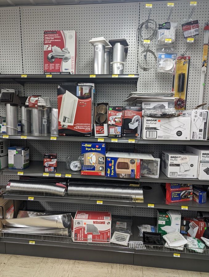 A store shelf filled with a variety of HVAC items.