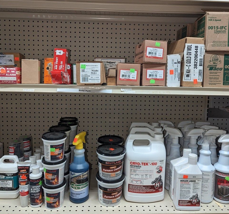 A shelf filled with lots of HVAC cleaning supplies on it.