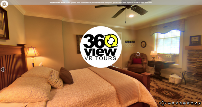 A 360 view of a bedroom with a bed and a fireplace