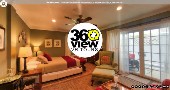 A 360 view of a bedroom with a ceiling fan and sliding glass doors.