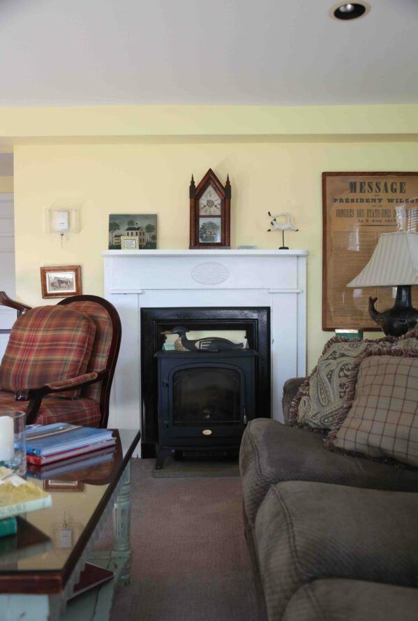 A living room with a fireplace and a sign that says message