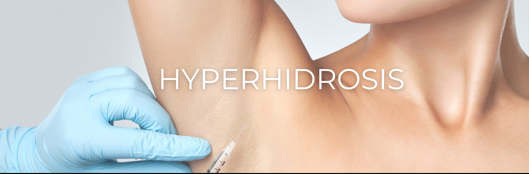 A woman is getting an injection in her armpit.