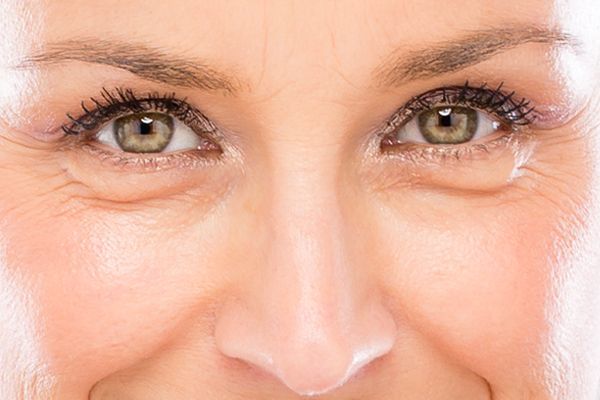 A close up of a woman 's eyes and nose.