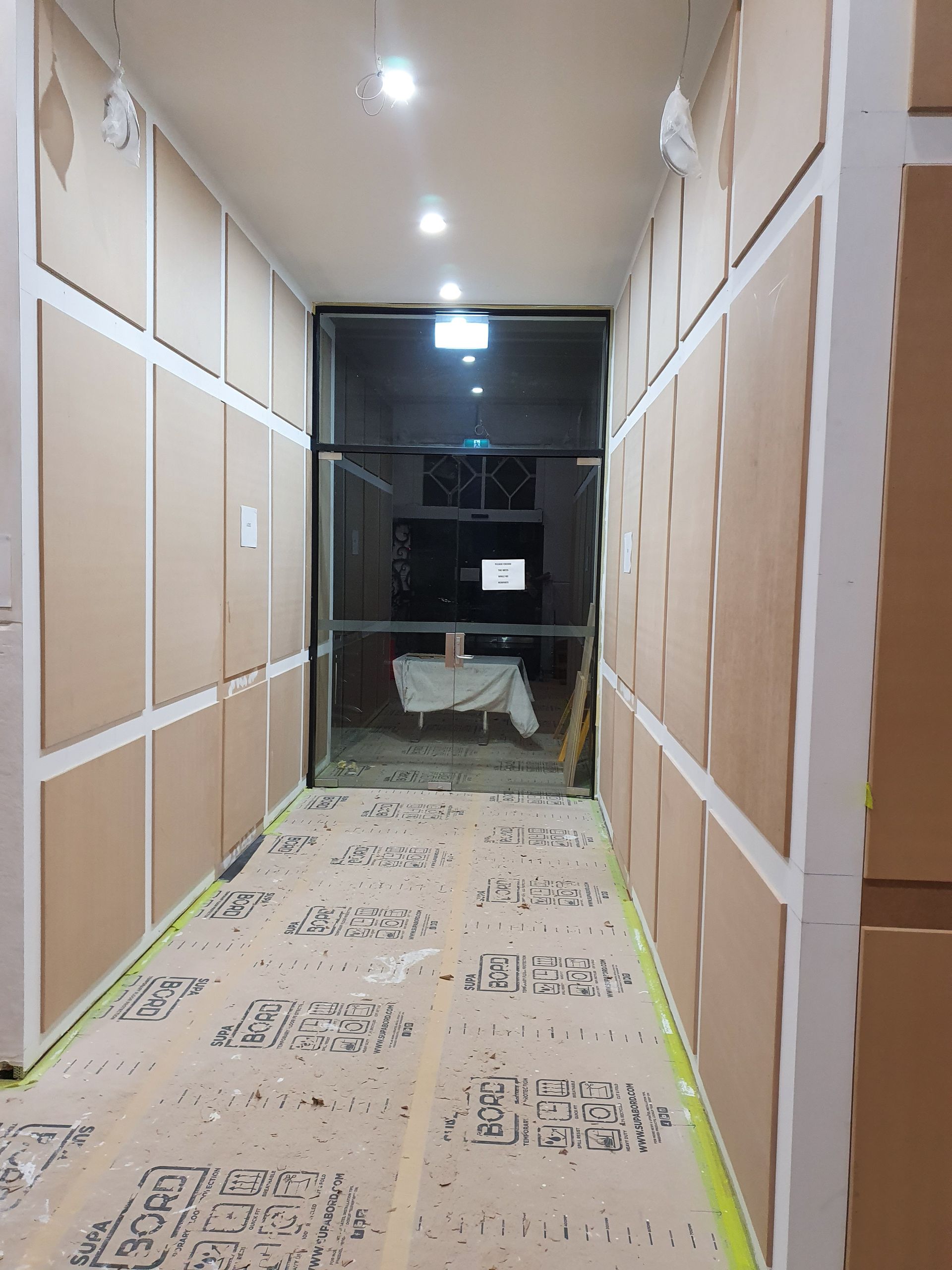 An Empty Room with Stairs and A Wooden Railing — Mezcon Group in Reservoir, VIC