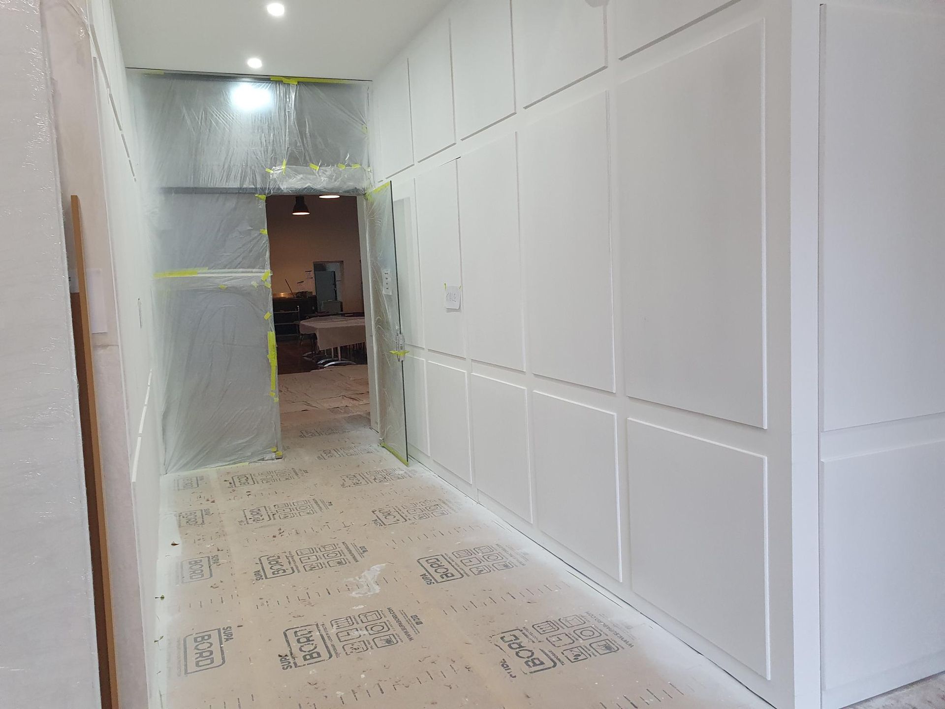 A Room Is Being Remodeled with Drywall and A Scaffolding — Mezcon Group in Bulleen, VIC