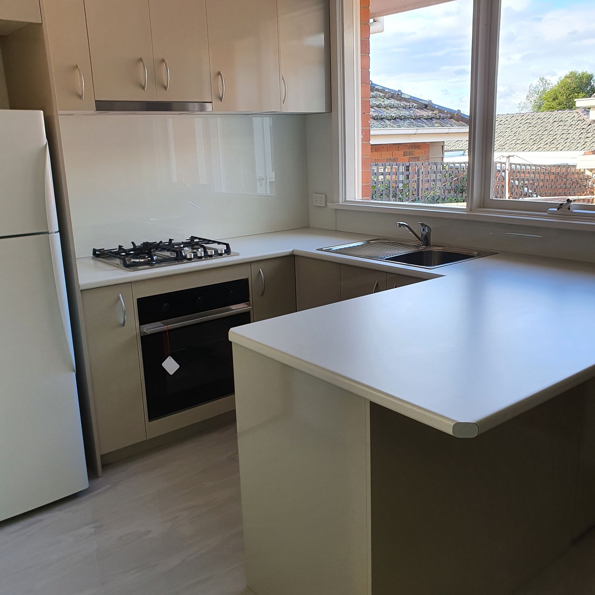 A Person Is Standing Next to A Roll of Black Asphalt — Mezcon Group in Eaglemont, VIC