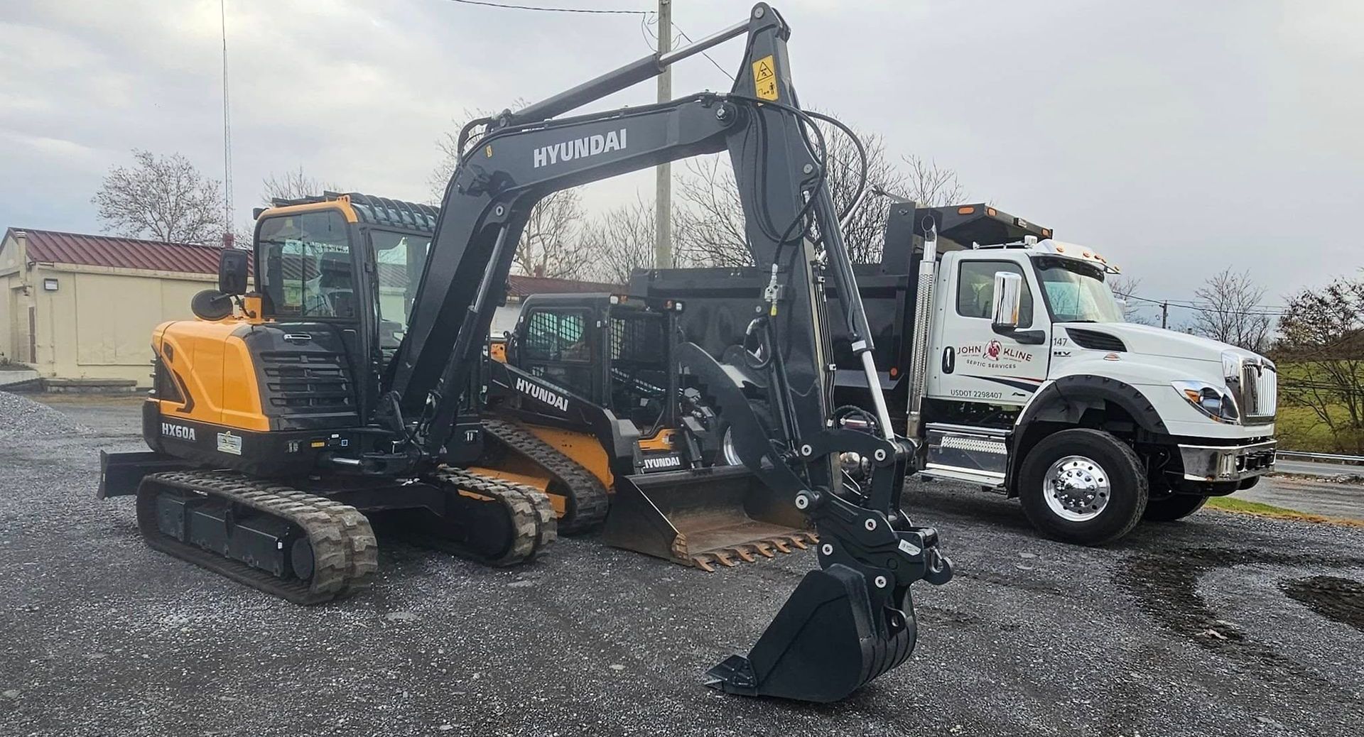 Excavation for Septic System Repairs and Installations | John Kline Septic Services Skid Steer, Dump Truck and Excavating equipment