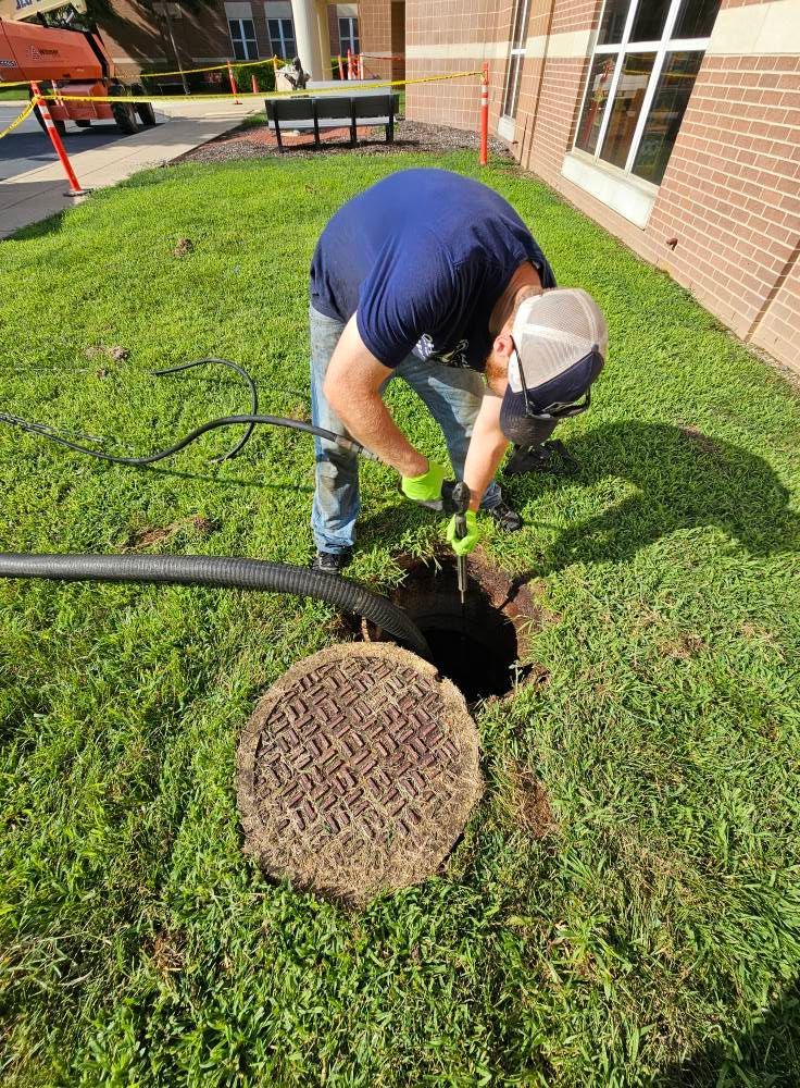 Professional plumber using specialized tools for effective drain cleaning, ensuring optimal flow.