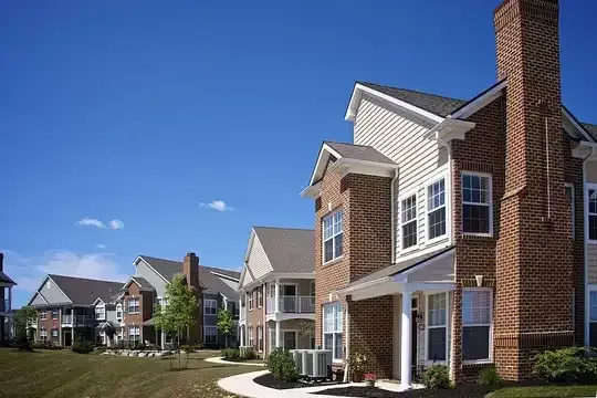 Manhole Cover in Green Grass | Residential Septic Services