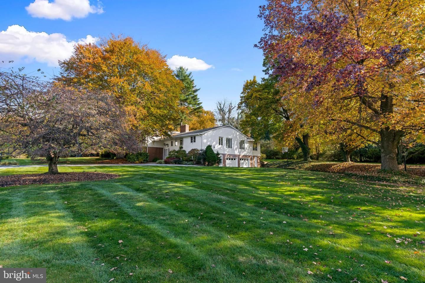 septic pumping technician digging open a manhole cover