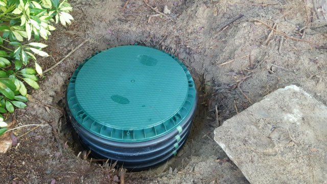 septic tank risers being installed | John Kline Septic 