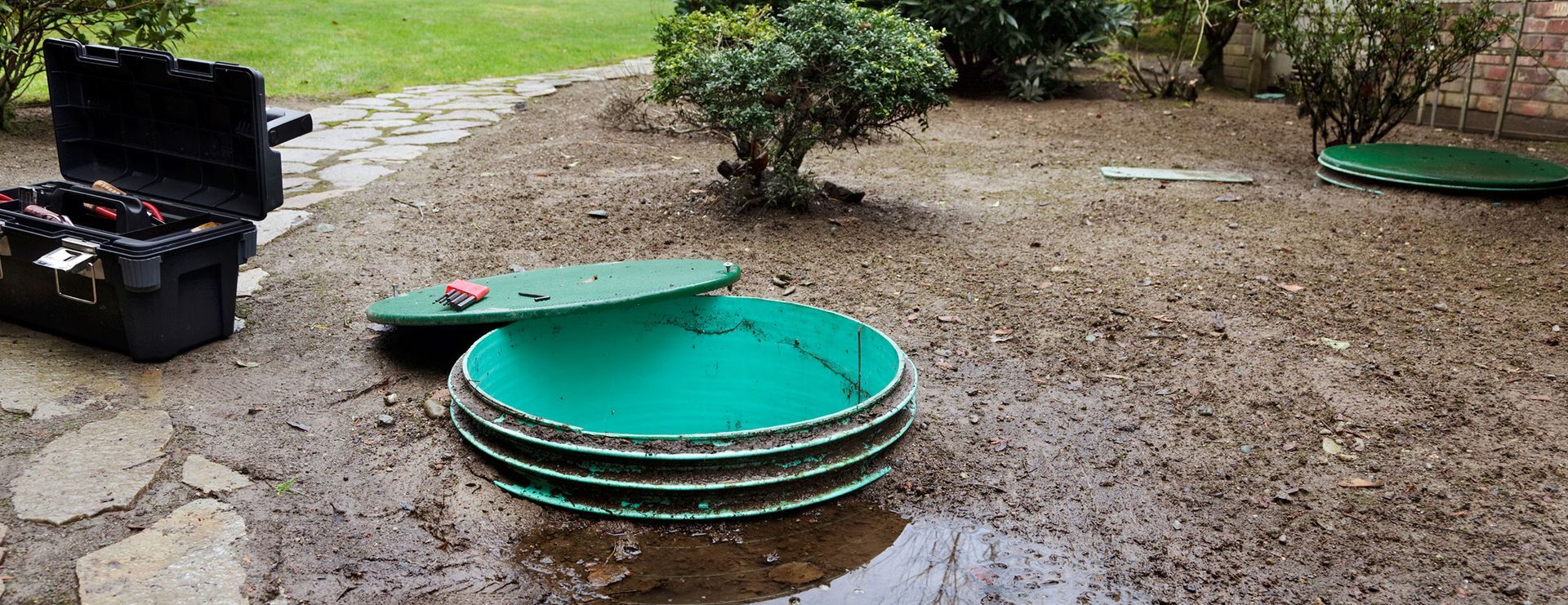 septic system manhole cover open for septic pumping