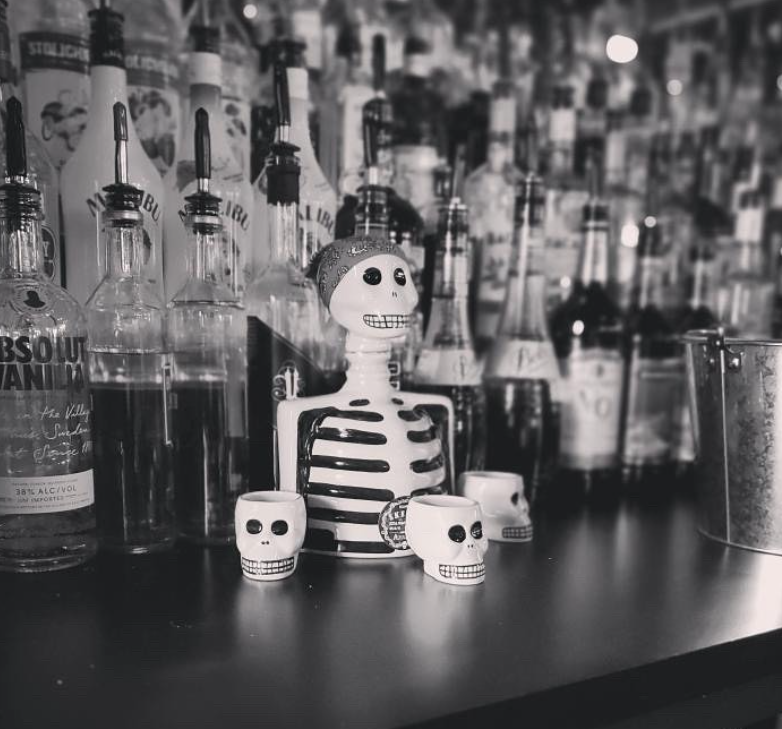 Skelly with Skelly Shot Glasses at a Bar