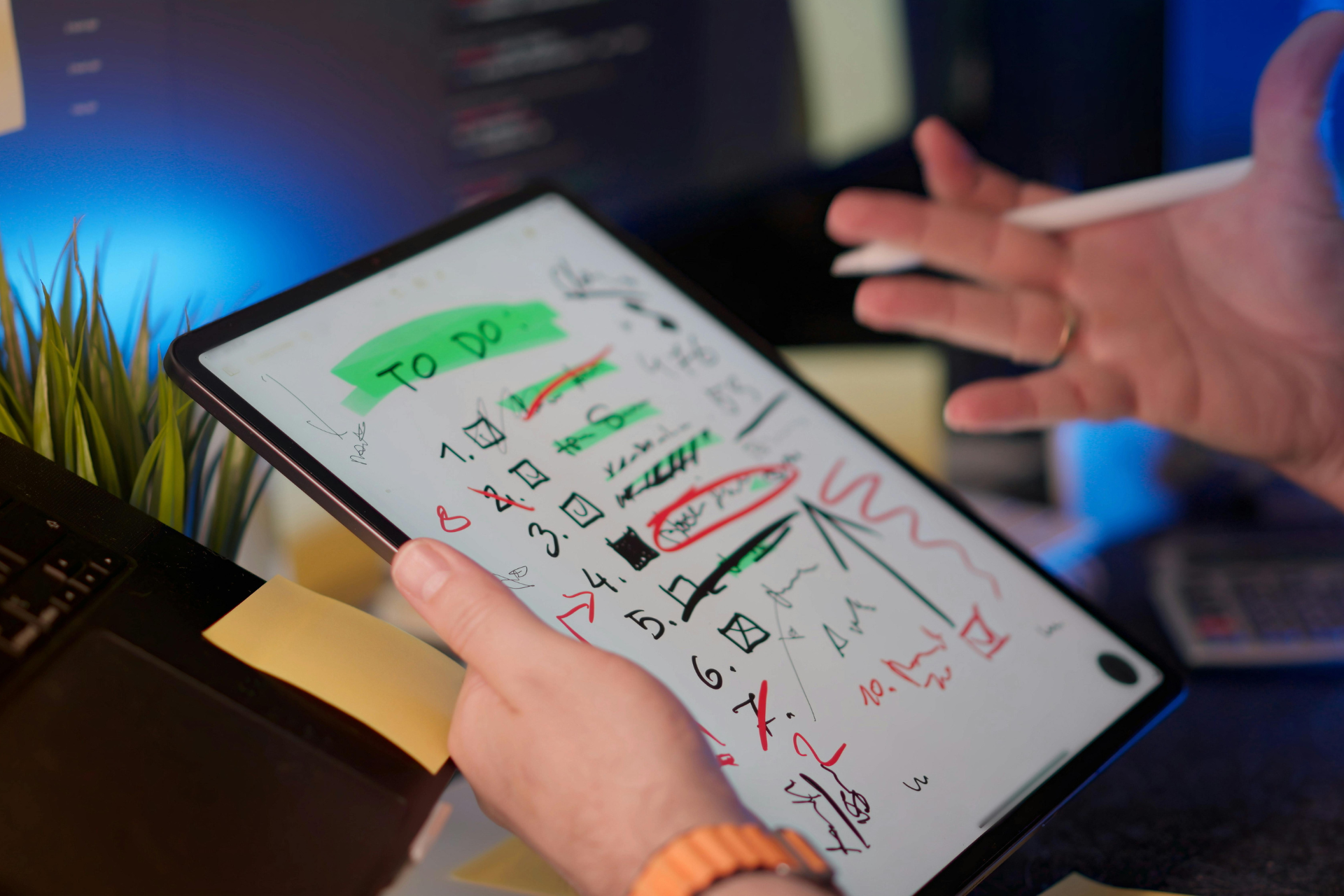 Person holding tablet displaying a 