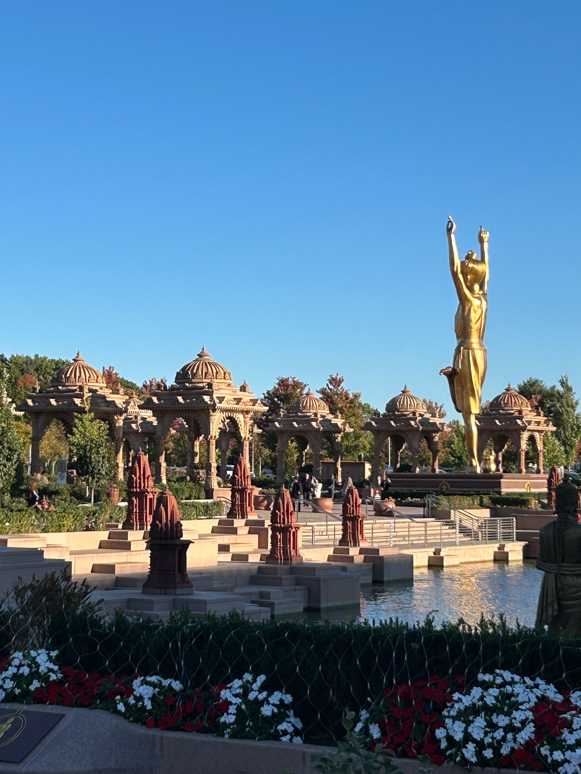 A fountain with a statue in the middle of it