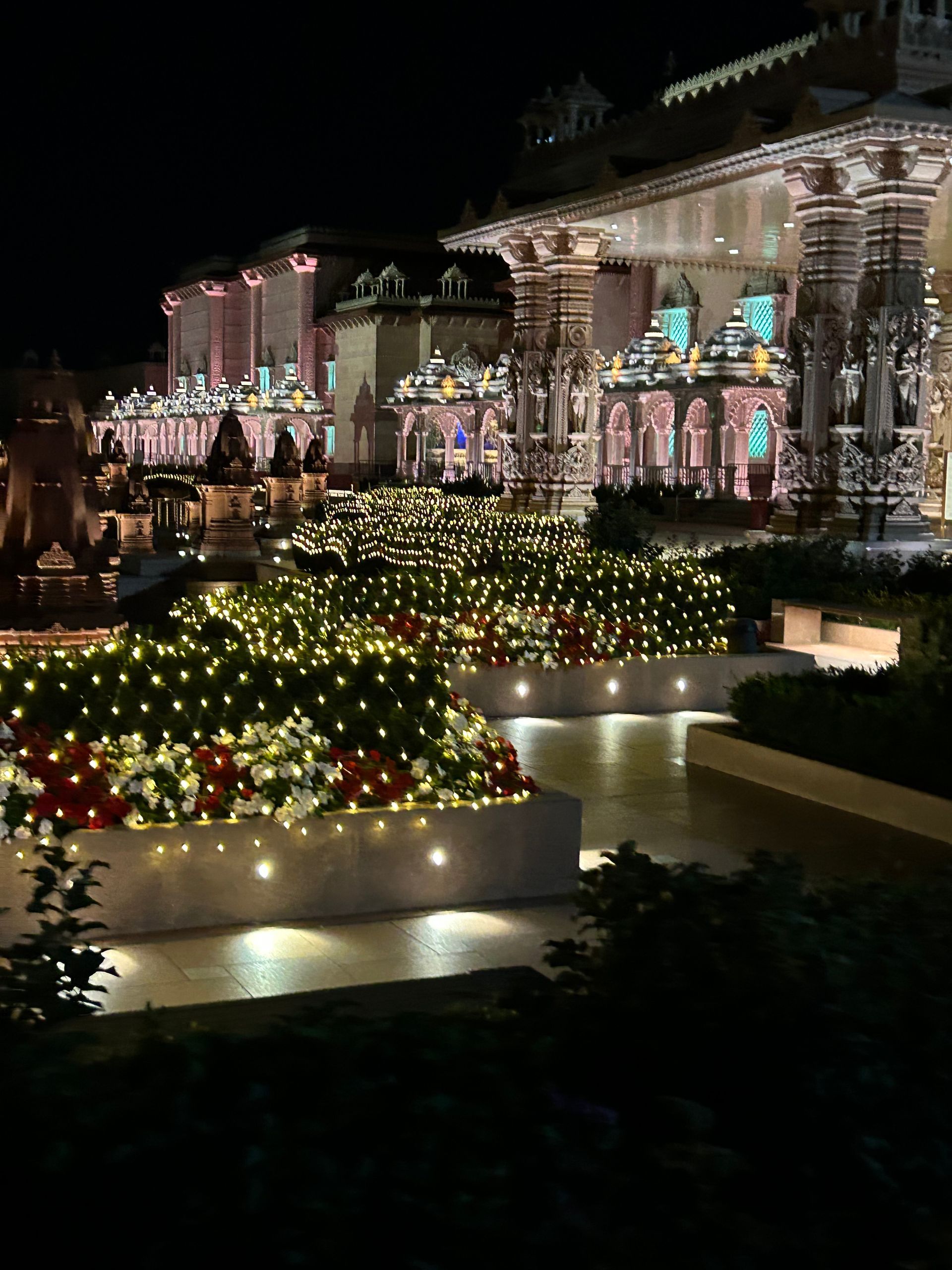 A large building with a lot of lights on it at night