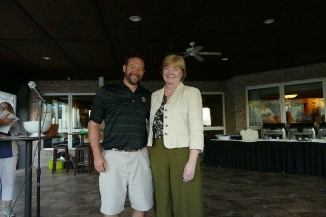 A man and a woman are posing for a picture