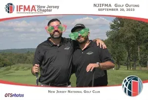 Two men are posing for a photo at the njfma golf outing