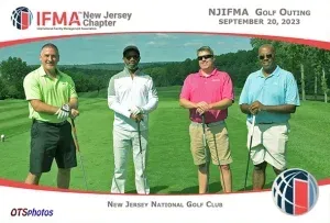 Four men are posing for a picture on a golf course sponsored by the new jersey national golf club