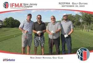 A group of men are posing for a picture on a golf course