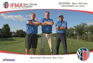 Three men standing on a golf course with their arms crossed