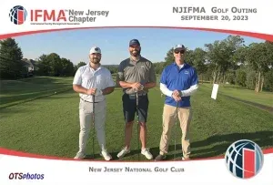 Three men are posing for a picture on a golf course sponsored by the new jersey national golf club
