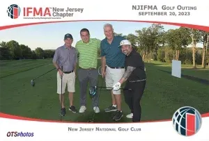A group of men are posing for a picture on a golf course