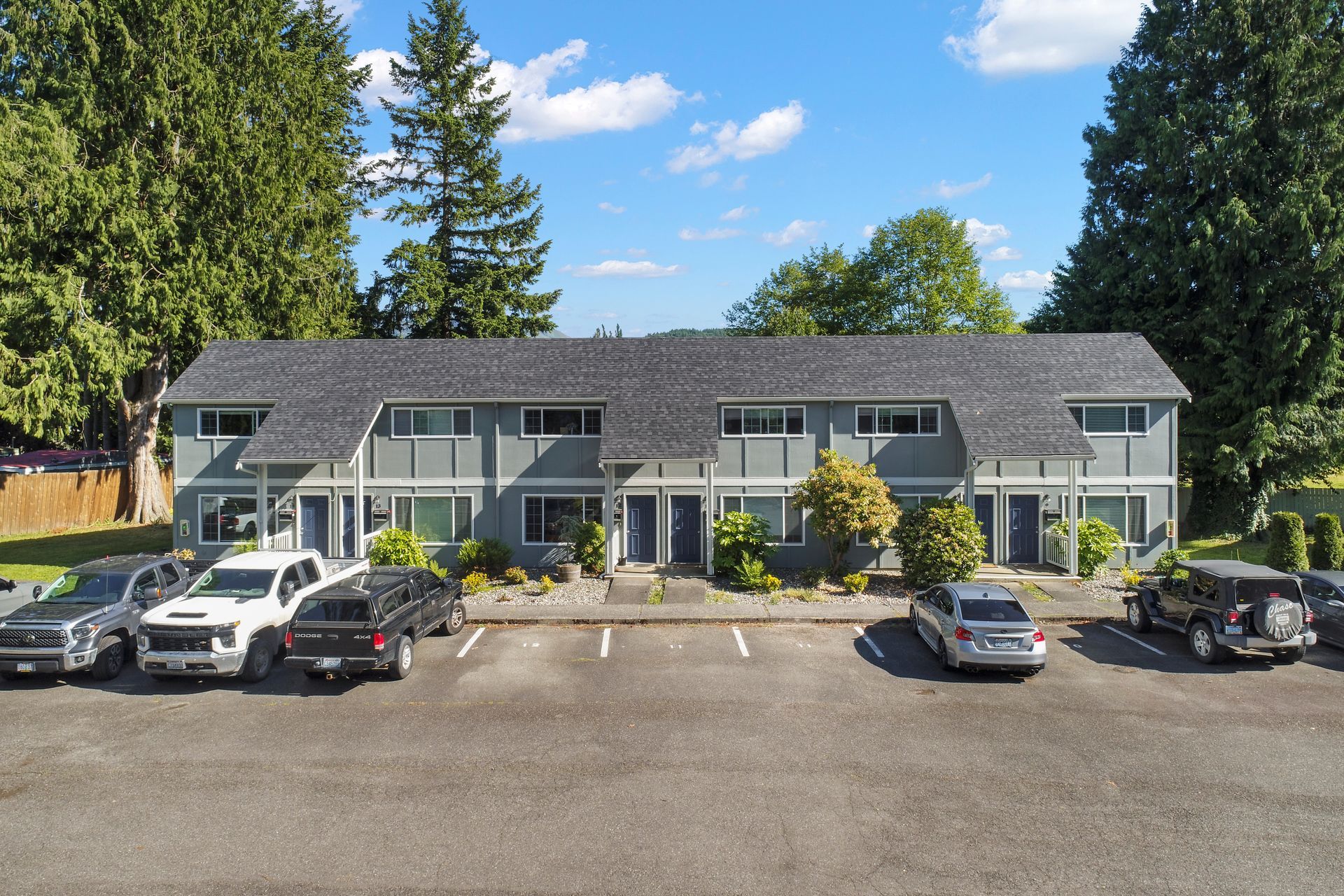 A building with a lot of cars parked in front of it