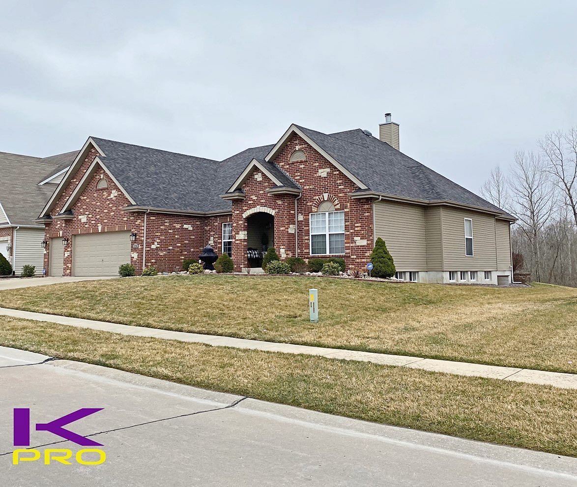 Hose with Red Siding | Manchester, MO | KPro Roofing & Renovation