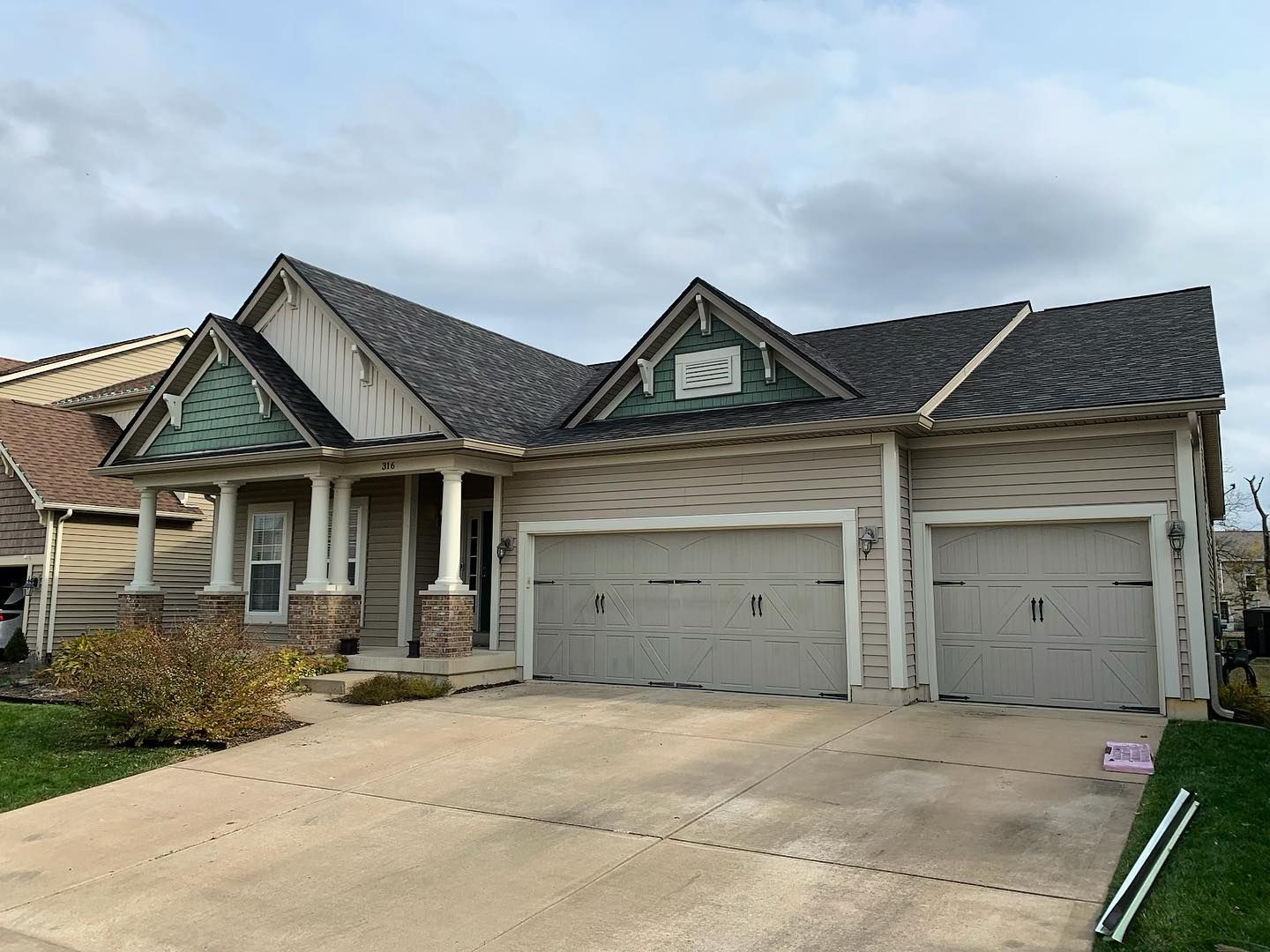 Hose with Grey Siding | Manchester, MO | KPro Roofing & Renovation