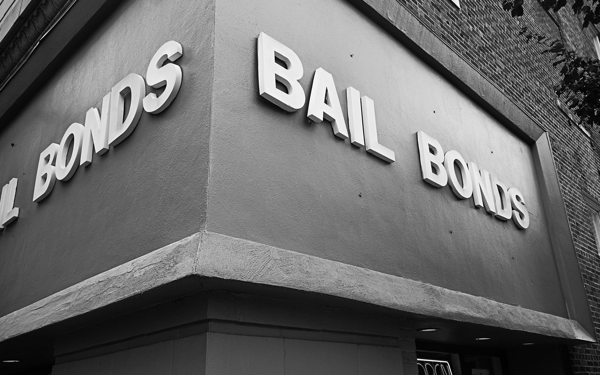 A black and white photo of a building that says bail bonds
